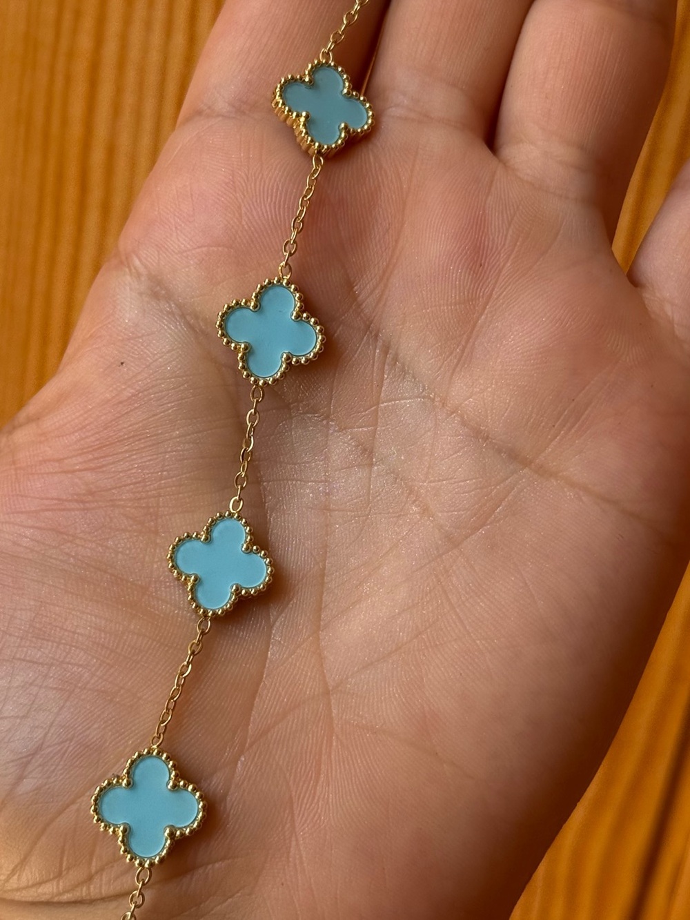 Gold Bracelet with Light Blue Clover Motifs - Women Jewelry